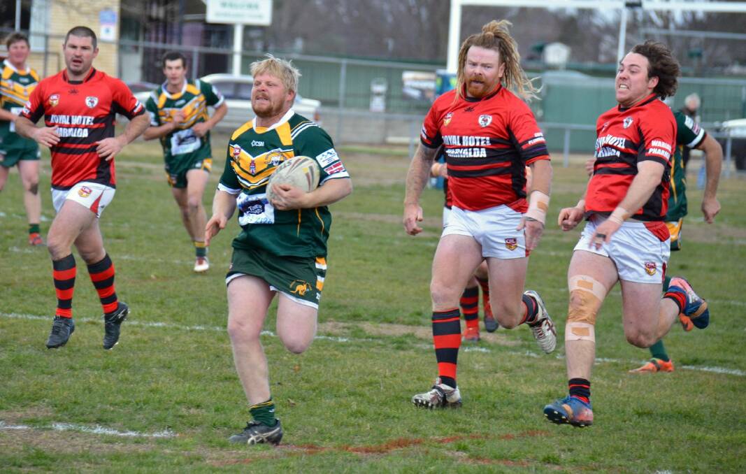 IN THE CLEAR: Dean Kelly busts open the Warialda defence. Photo: Ellen Dunger. 