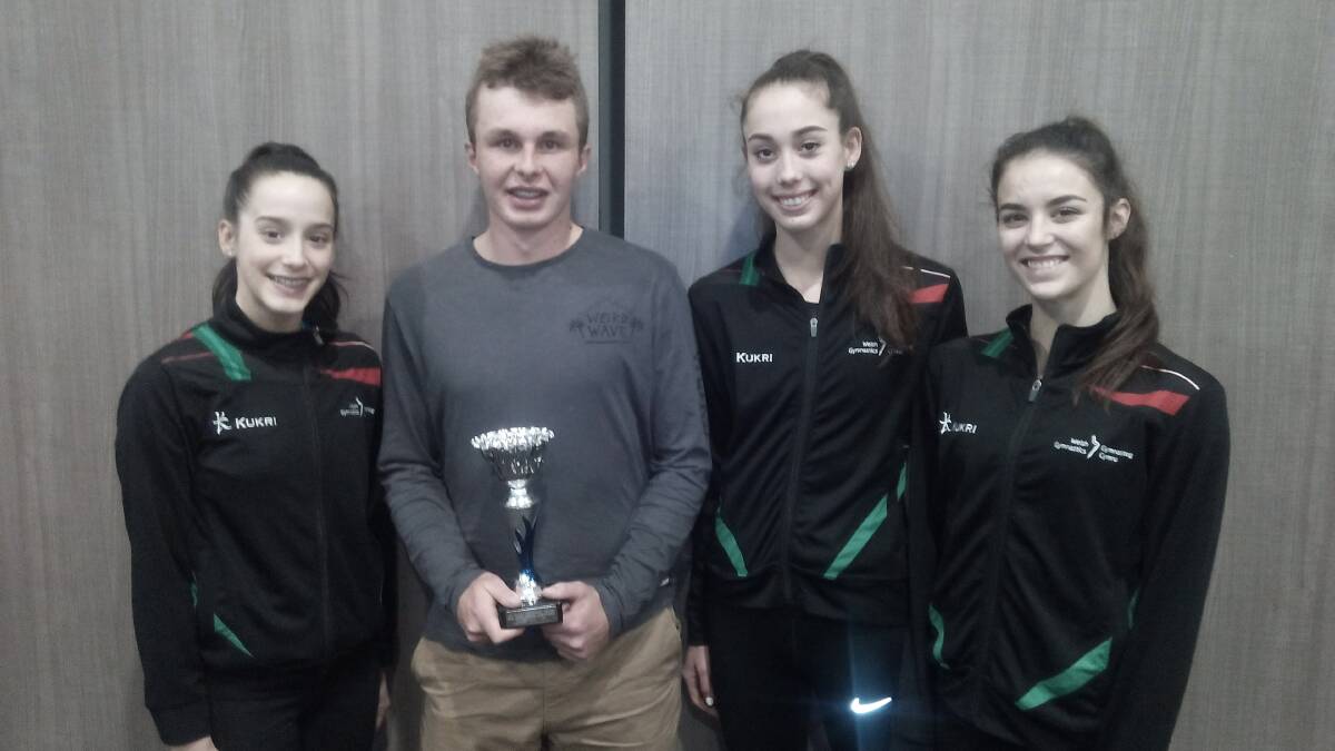 WINNER: Morgan Dunn, pictured with members of the Welsh Gymnastics team, beat some impressive talent to claim New England's junior regional athlete of the year.