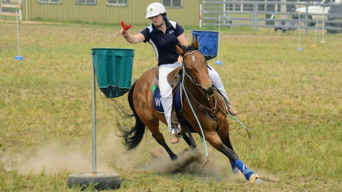 NEED FOR SPEED: Hannah Dunn and Candy compete in the flag race at the Walcha interclub. Photo: Contributed. 
