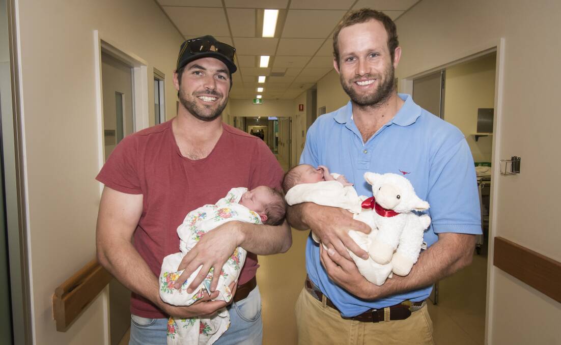 Special time: Pirates' Doug Biffin with new daughter Maggie and Walcha's Sandy Cameron with son Wallace. Photo: Peter Hardin