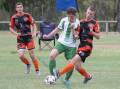 Moore Creek captain Hayden Davidson jostles with a Sawtell opponent during their Australia Cup clash on Sunday. Picture by Peter Hardin
