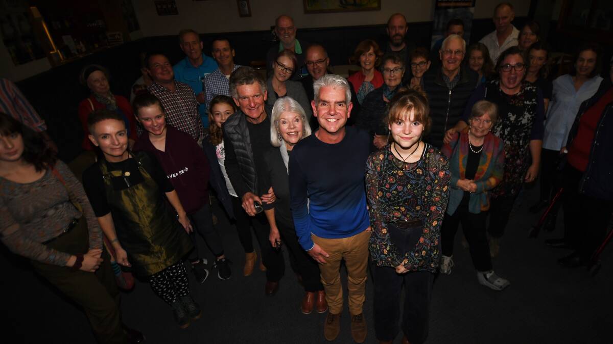PROUD BUT PERPLEXED: Adam Blakester flanked by his supporters on election night. Photo: Gareth Gardner