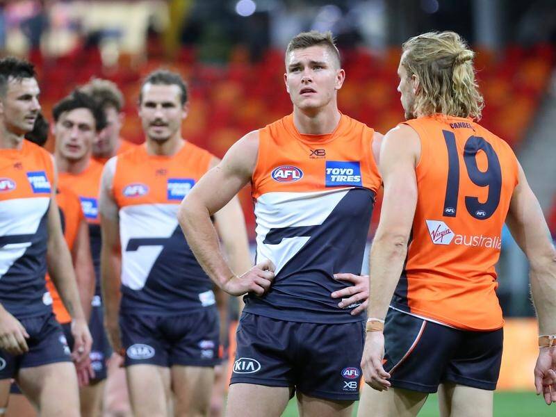GWS players looked distraught after their 61-point AFL thumping by Western Bulldogs.