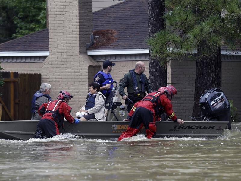 Four people have died and hundreds were rescued after Imelda flooded parts of Texas and Louisiana.