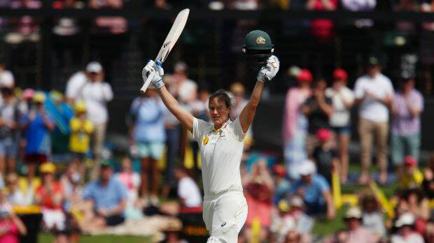 Cracking knock: Ellyse Perry salutes the crowd after reaching triple figures. Photo: AAP