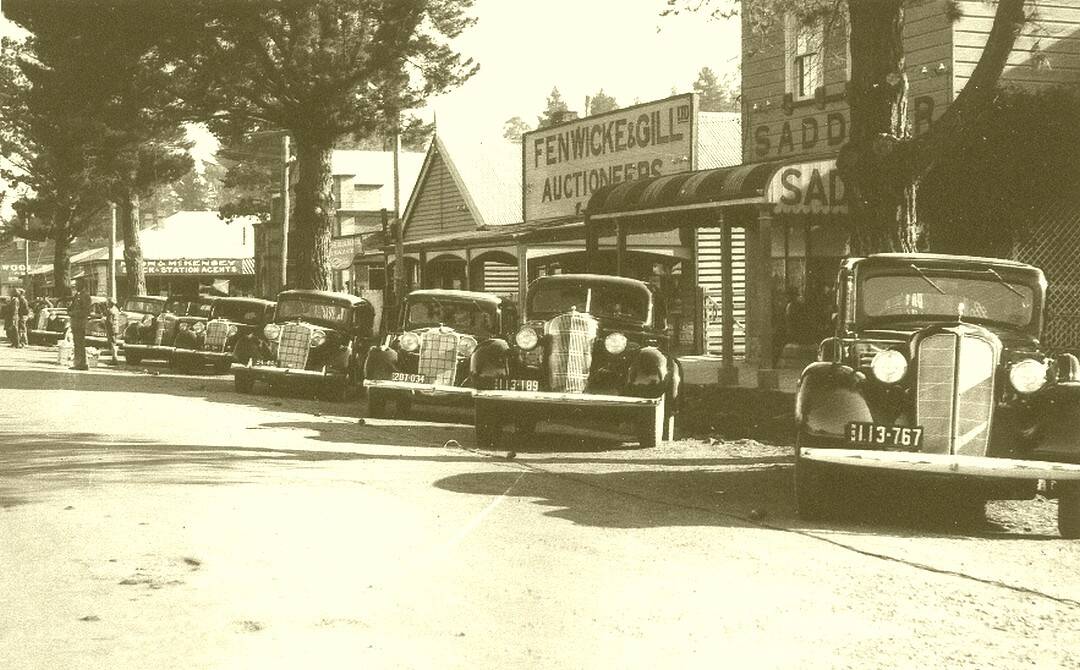 A 1934 photo of a display in Derby Street of General Motors vehicles Vauxhall, Pontiac and Buick sedans.