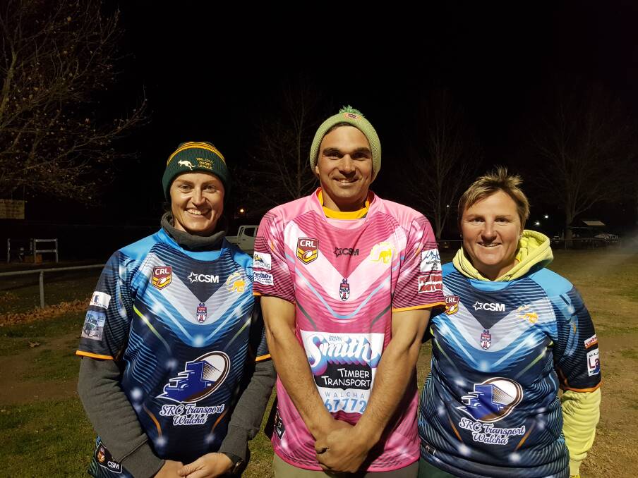 Under the hammer: Roos captain Steve Eveleigh, Jillaroos co-coaches Bonnie Brown and Robyn Broadbent in the guernseys that will be auctioned Saturday evening.