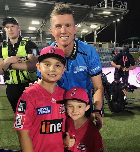 Kids at Big Bash: Koby and Bentley Brennan with recently retired international cricketer Peter Siddle.