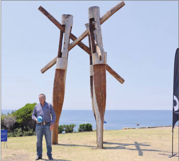 Stephen King with his work ‘fallout’ in the Sculpture by the Sea exhibition at Bondi last Friday. 
